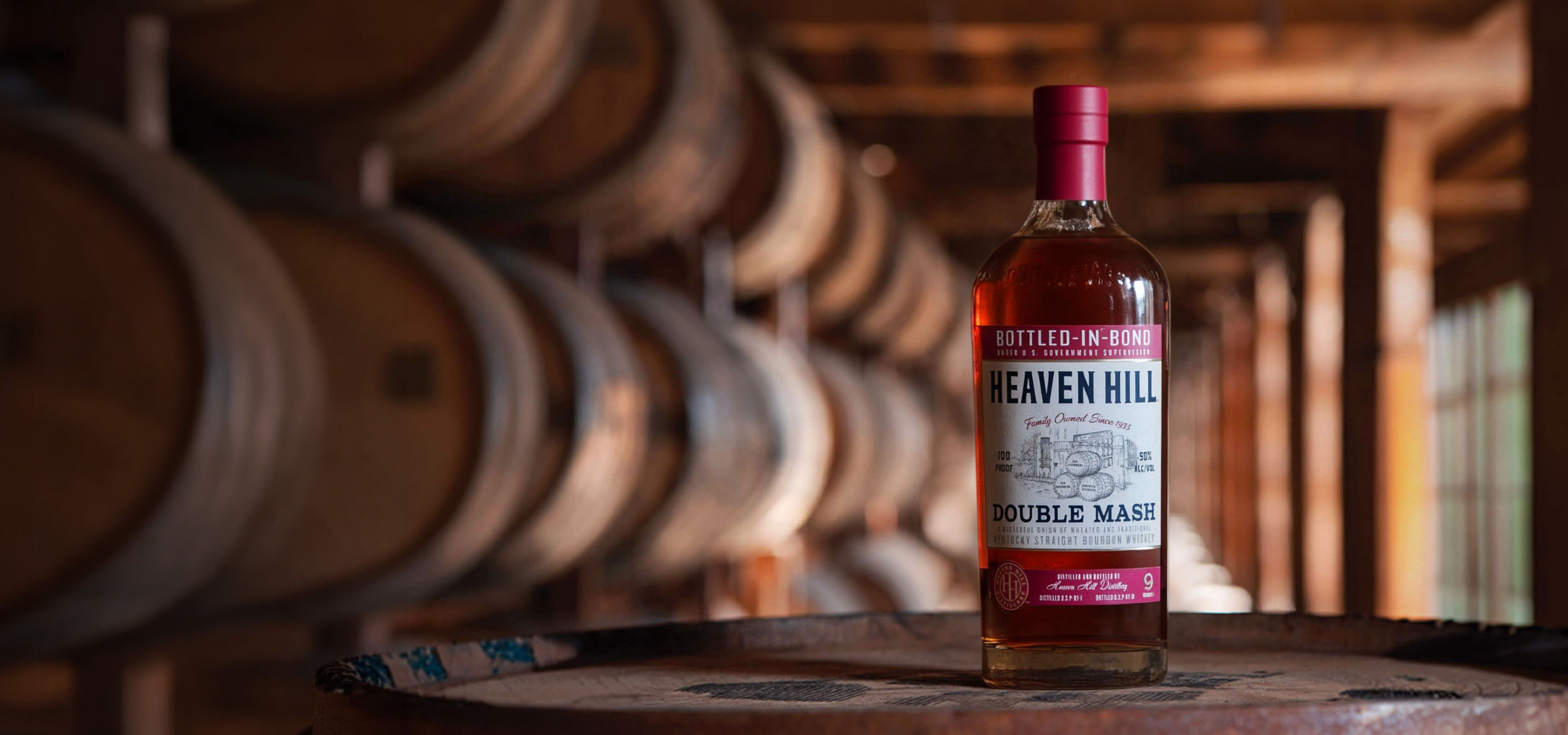 Heaven Hill Bottled-in-Bond Double Mash bottle on a barrel in a rickhouse